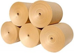 Kraft paper reels stacked in a warehouse